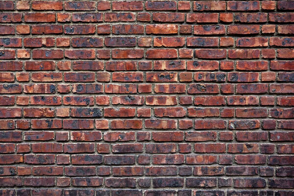 Carta da parati antico muro di mattoni scuri