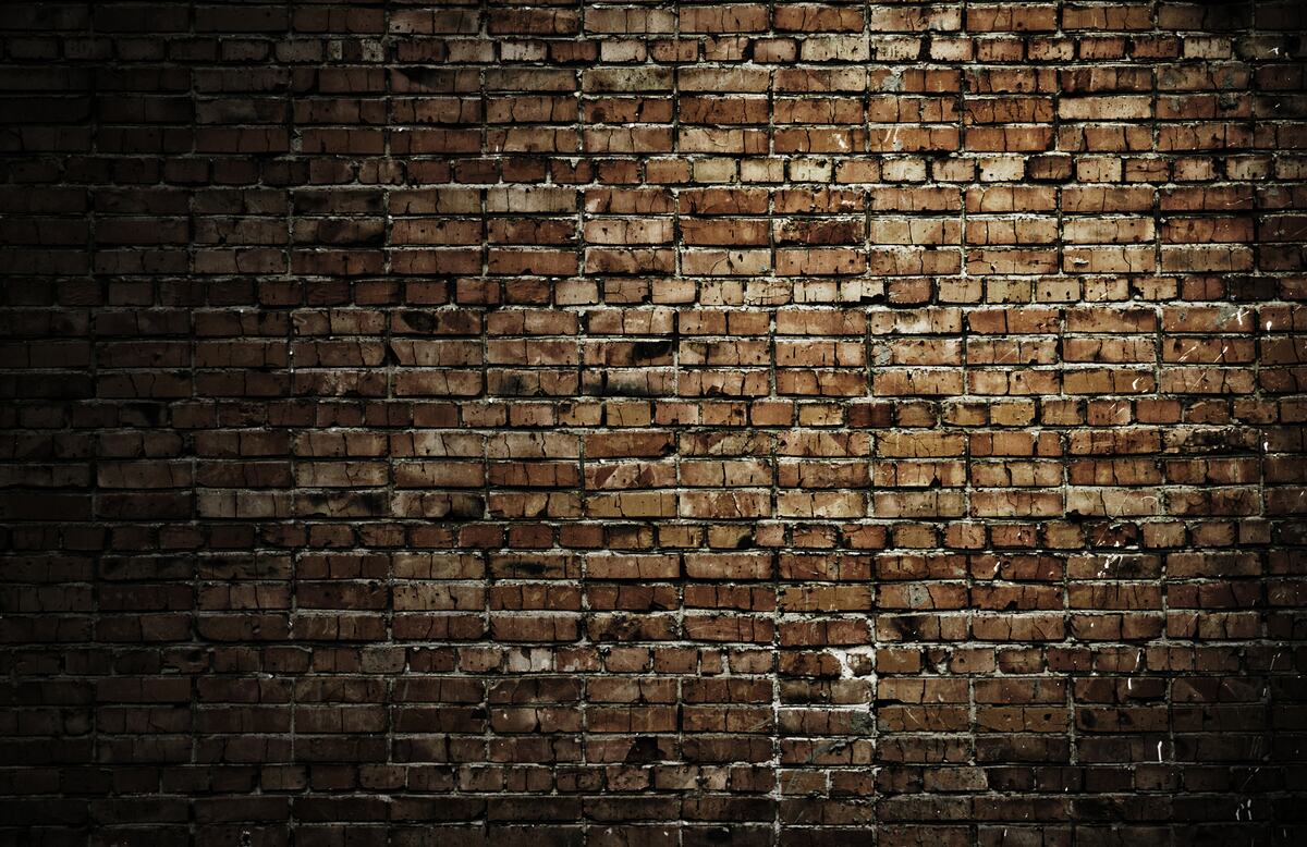 Carta da parati muro di mattoni scuri