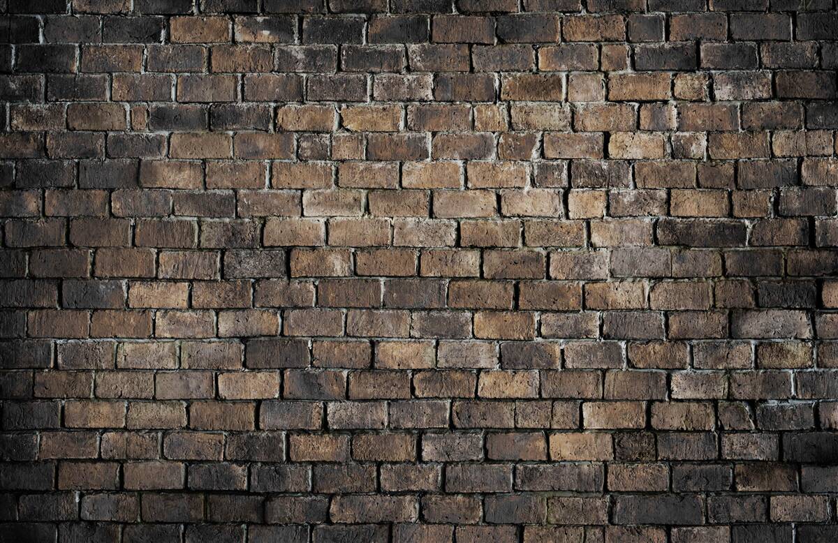 Carta da parati colore scuro di un muro di mattoni