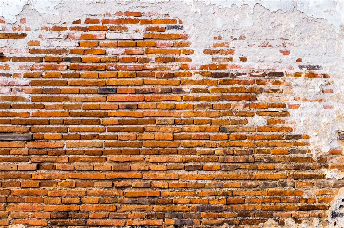 Carta da parati vecchio muro di mattoni che ha perso il suo aspetto