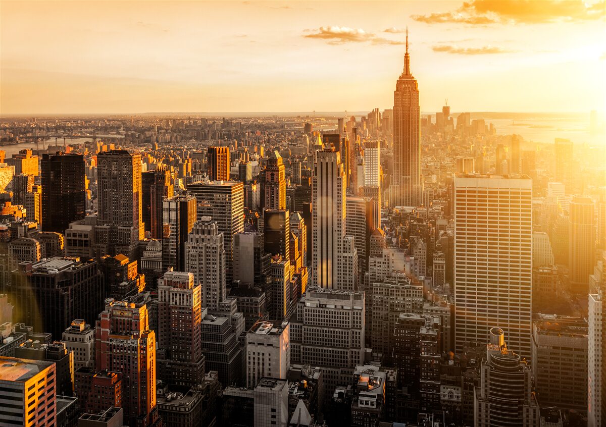 Carta da parati i grattacieli di new york alla luce del tramonto