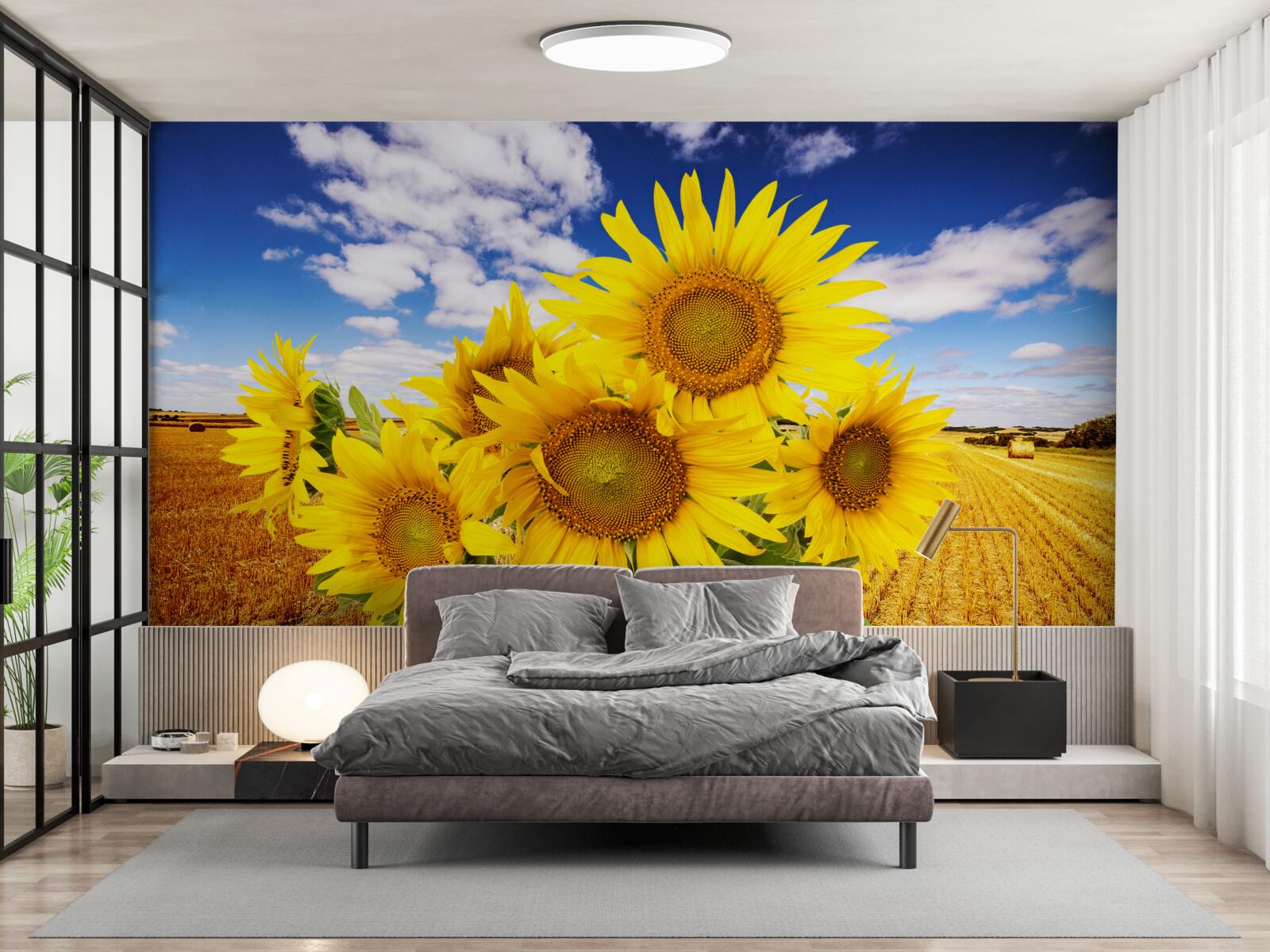 Carta da parati un mazzo di girasoli si staglia contro il cielo e un campo di grano