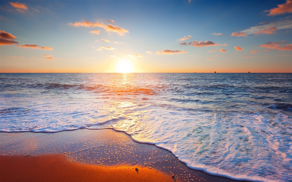 Carta da parati il tramonto che scompare tra le onde